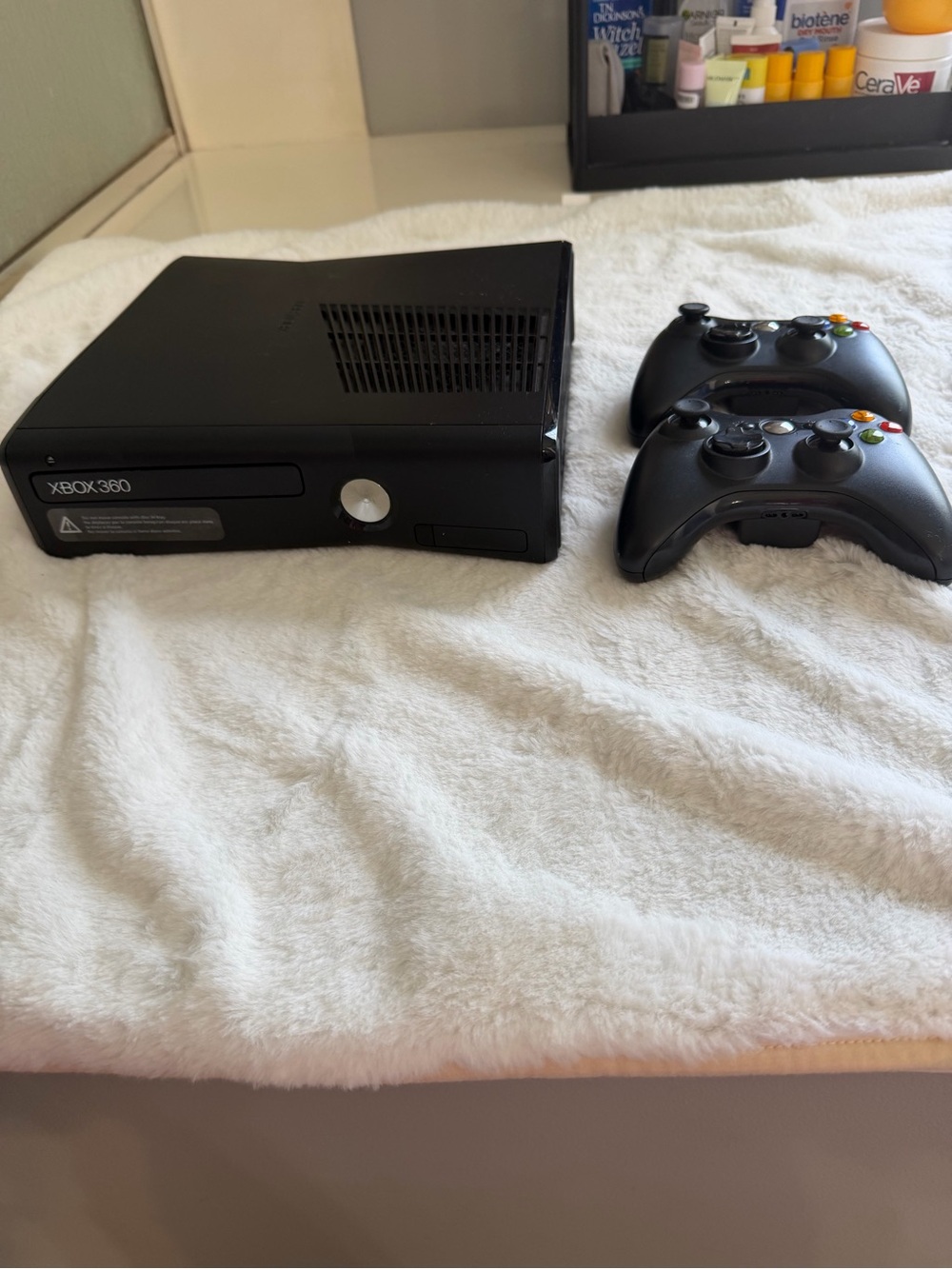 Microsoft Xbox 360 Slim Console with Two Black Wireless Controllers